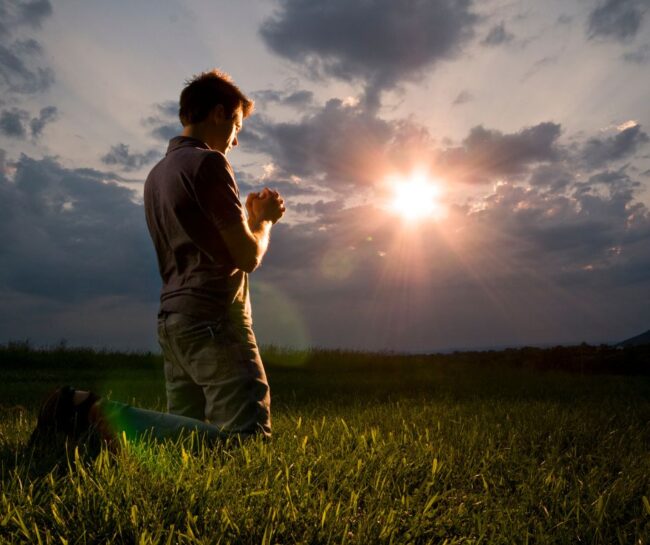 picture of person worshipping Christian heritage